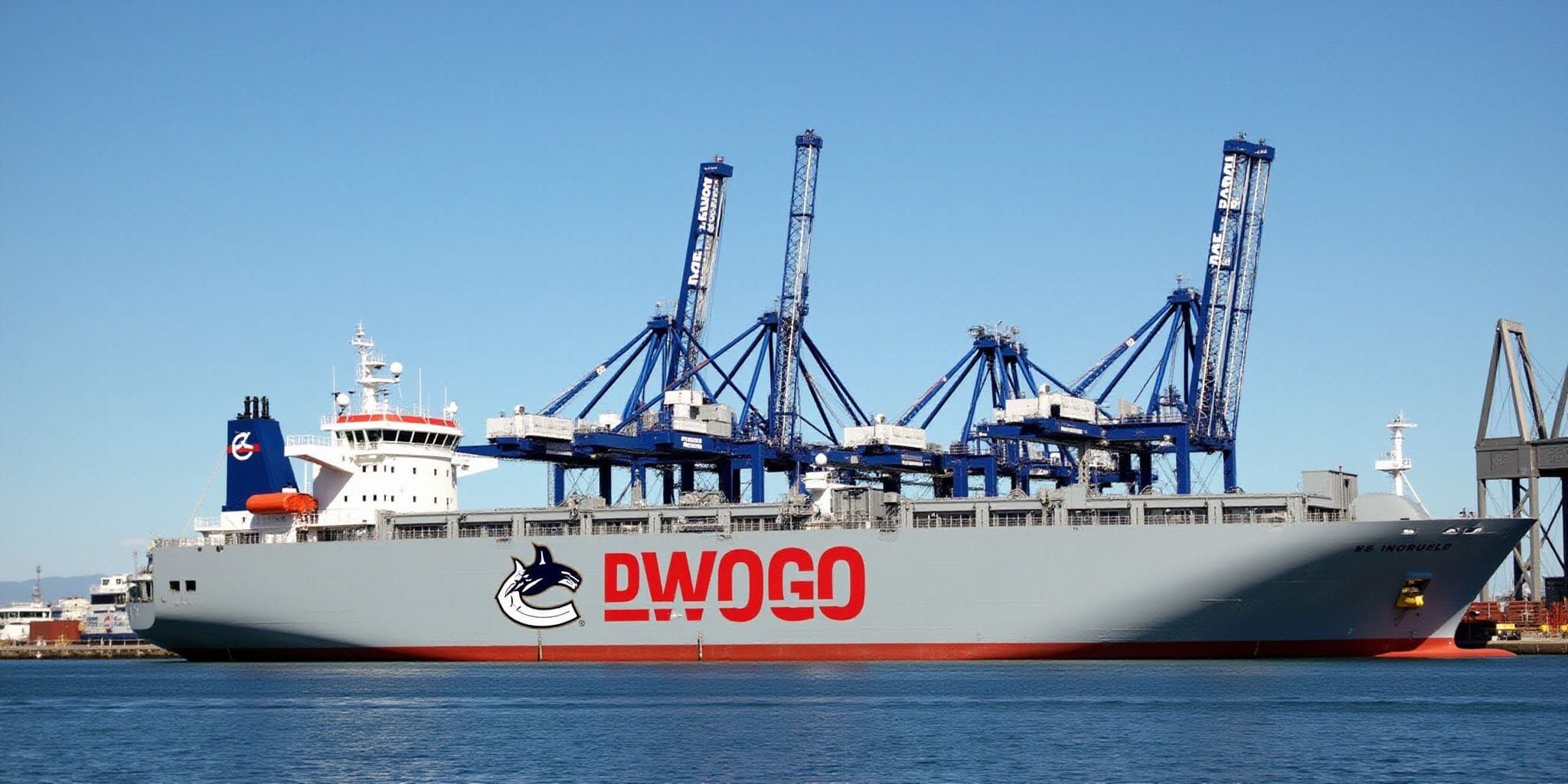 The image depicts a large cargo ship docked at a port, showcasing its distinctive features. The vessel's body is predominantly gray, with a striking red stripe running along its bottom edge. A notable logo on the side of the ship consists of two black wolves facing each other, their heads forming a circle and creating a stylized "C" shape that mirrors the red stripe below.

In the foreground, several large cranes are visible, while in the background, additional ships and buildings can be seen docked at the port. The sky above is a brilliant blue, devoid of any clouds or obstructions. Overall, the image presents a clear and detailed view of the cargo ship and its surroundings, providing an interesting glimpse into the world of maritime commerce.