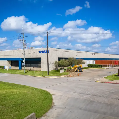 Industrial building, vacant lot, construction site, warehouse, concrete structure, urban decay, empty space